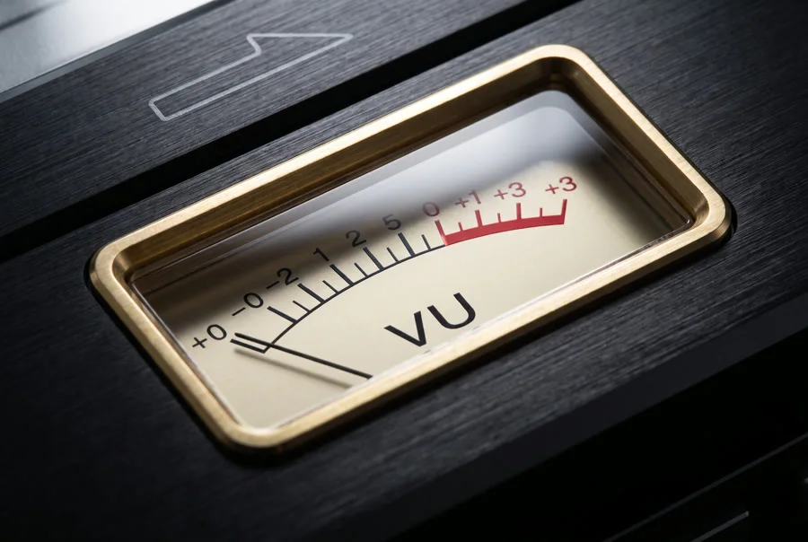 Brass VU meter set into the brushed aluminium panel